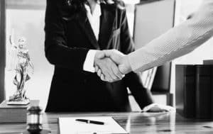 Lawyer and client shaking hands