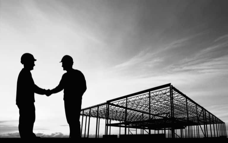 Two Person Shakes Hands as Featured Image for Legal Challenges in Atlanta Insights from Construction Lawyers